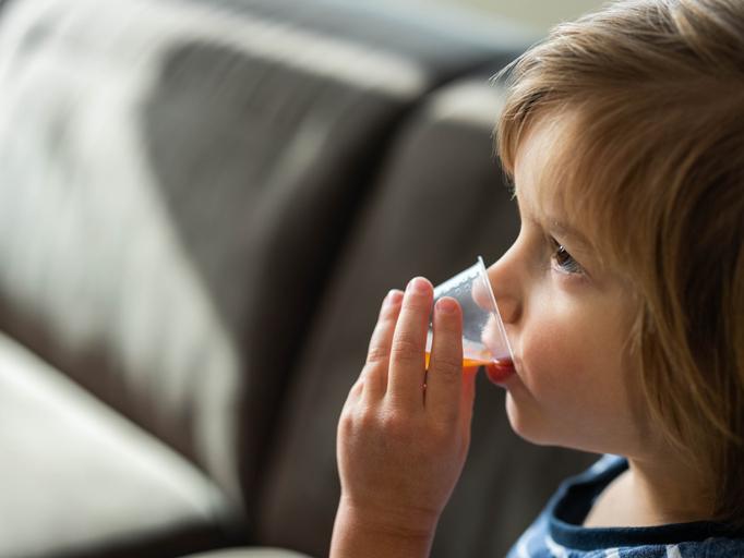 Child taking medicine